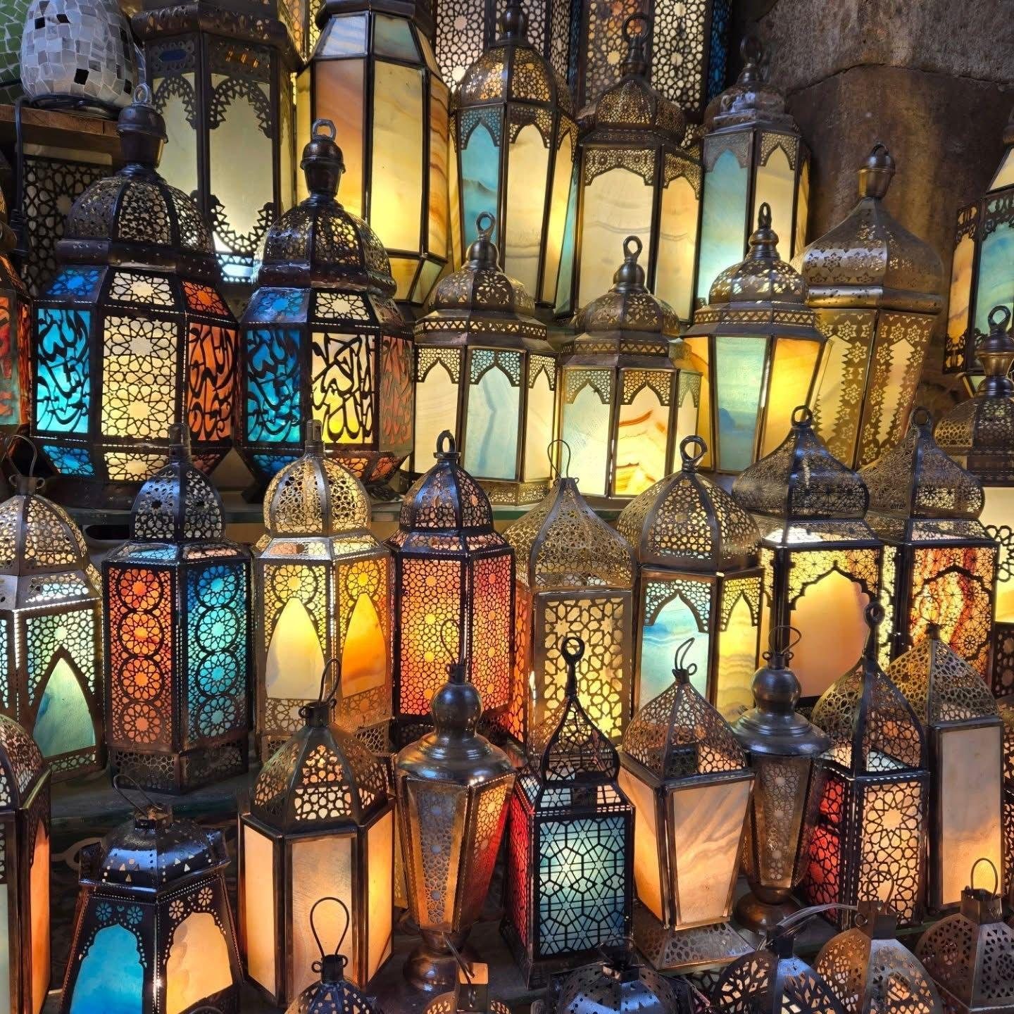 Handmade brass lanterns glowing in Khan El-Khalili